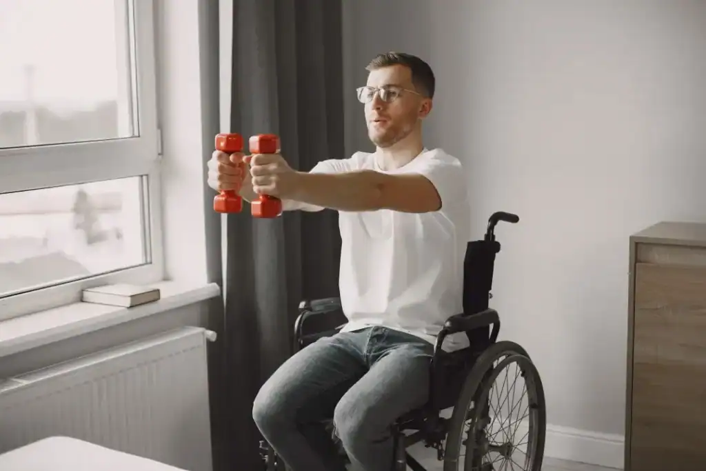 Image of man doing exercise in his wheelchair to aid weight loss Derbyshire