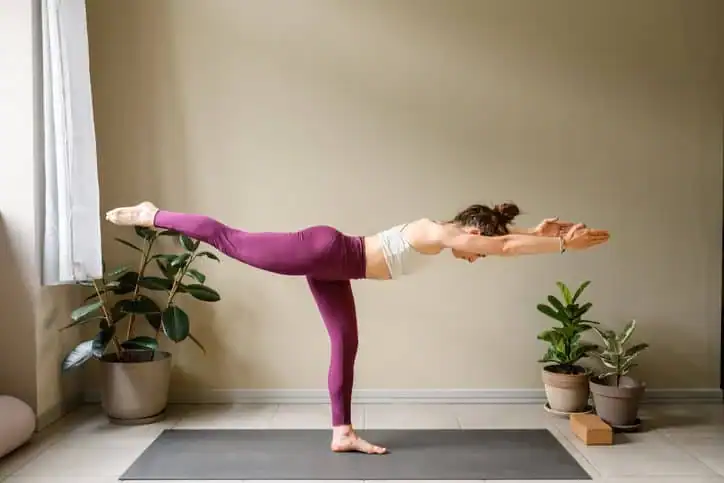 Woman doing Yoga exercise Derbyshire to help with toning the body. 