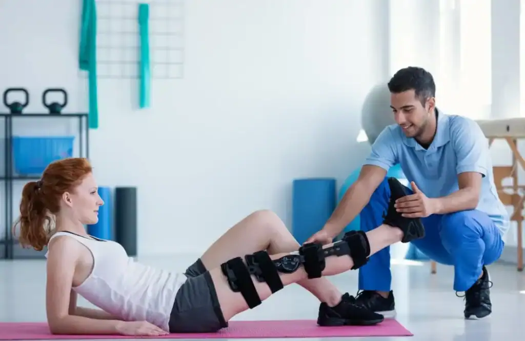 Woman having treatment to help muscle recovery Derbyshire after an injury