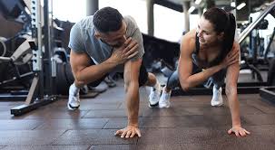 Image of man and woman doing Cardio Derbyshire to tone their arms. 